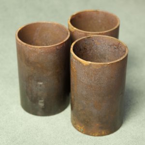 Copper tube sections with layer of tarnish.